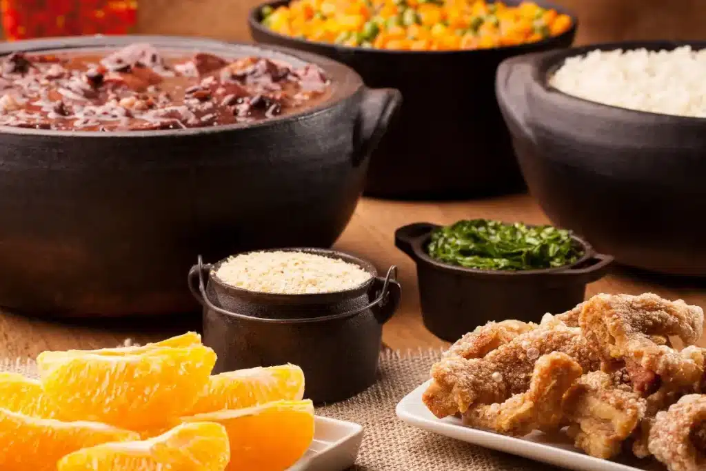 Traditional Brazilian feijoada with rice and collard greens for a Brazilian food experience in Florida
